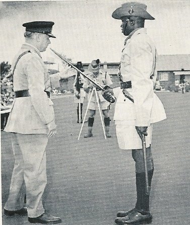 
Lt Idi Amin receives the sword of honour from the former G.O.C. E.A. Command, Maj Gen. Sir Nigel Tapp at his effendi's passing out parade. Notice how slim this gentleman was in December 1961.